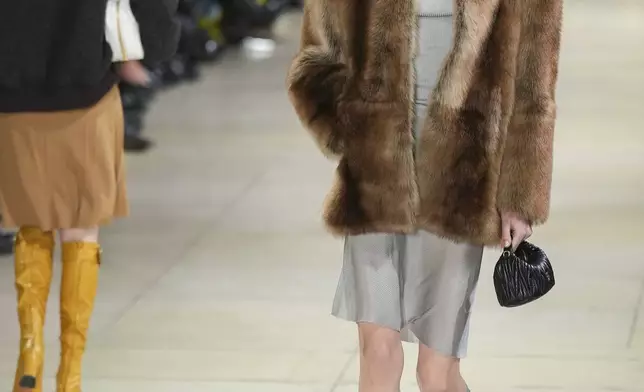 A model wears a creation as part of the Miu Miu Fall/Winter 2025-2026 Womenswear collection presented Tuesday, March 11, 2025. in Paris. (Photo by Scott A Garfitt/Invision/AP)