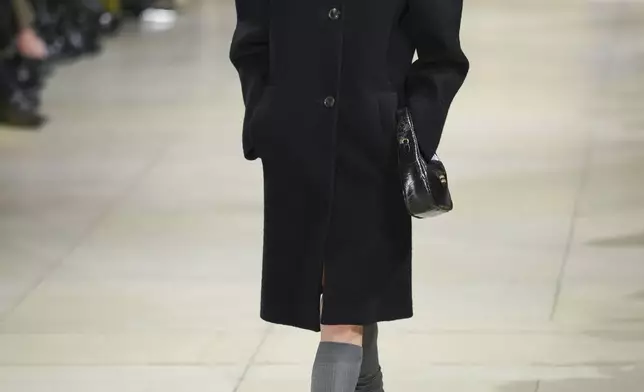 A model wears a creation as part of the Miu Miu Fall/Winter 2025-2026 Womenswear collection presented Tuesday, March 11, 2025. in Paris. (Photo by Scott A Garfitt/Invision/AP)