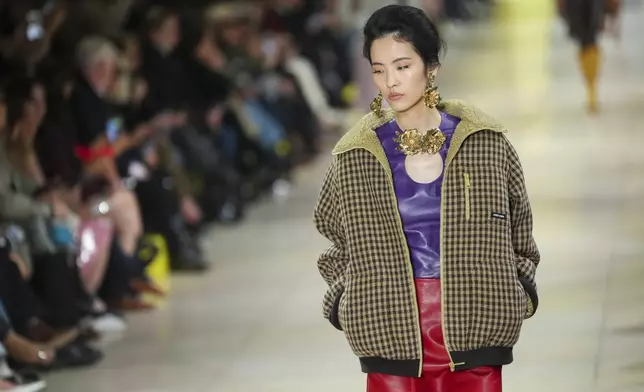 A model wears a creation as part of the Miu Miu Fall/Winter 2025-2026 Womenswear collection presented Tuesday, March 11, 2025. in Paris. (Photo by Scott A Garfitt/Invision/AP)