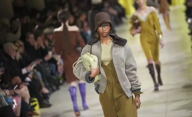A model wears a creation as part of the Miu Miu Fall/Winter 2025-2026 Womenswear collection presented Tuesday, March 11, 2025. in Paris. (Photo by Scott A Garfitt/Invision/AP)