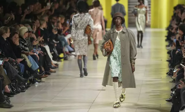 A model wears a creation as part of the Miu Miu Fall/Winter 2025-2026 Womenswear collection presented Tuesday, March 11, 2025. in Paris. (Photo by Scott A Garfitt/Invision/AP)
