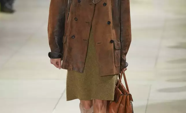 A model wears a creation as part of the Miu Miu Fall/Winter 2025-2026 Womenswear collection presented Tuesday, March 11, 2025. in Paris. (Photo by Scott A Garfitt/Invision/AP)