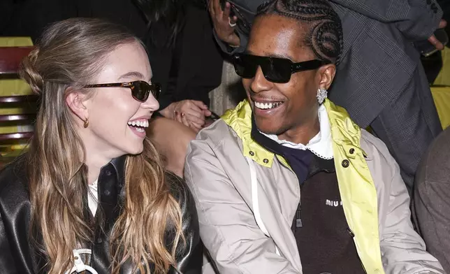 Sydney Sweeney, left, and A$AP Rocky attend the Miu Miu Fall/Winter 2025-2026 Womenswear collection presented Tuesday, March 11, 2025. in Paris. (Photo by Scott A Garfitt/Invision/AP)