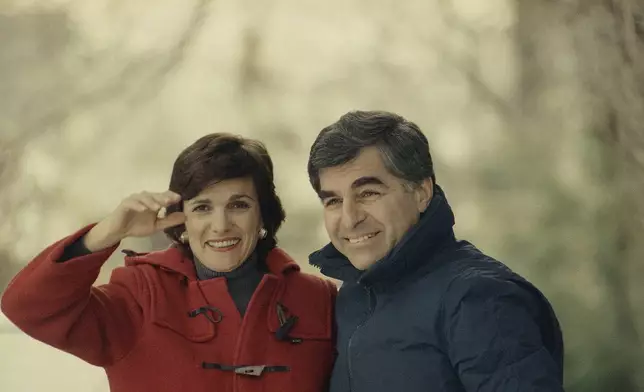 FILE - Kitty Dukakis, left, and Massachusetts Gov. Michael S. Dukakis are seen outside their home in Brookline, Massachusetts, March 7, 1989. (AP Photo/David Tenenbaum, File)