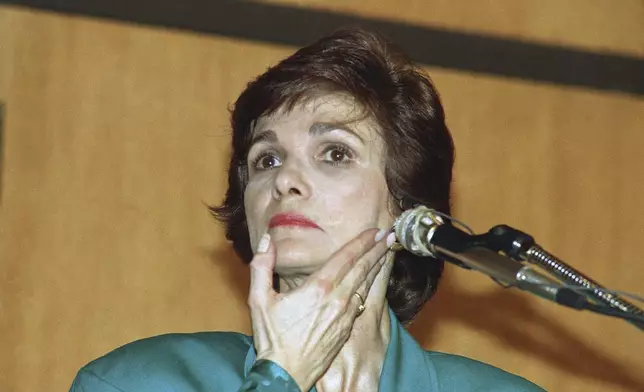 FILE - Kitty Dukakis listens to a question from the audience during a speaking engagement at Villanova University in Villanova, Pa, Wednesday, March 15, 1989. (AP Photo/Sean Kardon, File)
