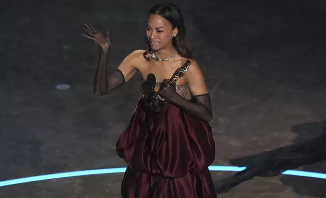 Zoe Saldana accepts the award for best performance by an actress in a supporting role for "Emilia Perez" during the Oscars on Sunday, March 2, 2025, at the Dolby Theatre in Los Angeles. (AP Photo/Chris Pizzello)