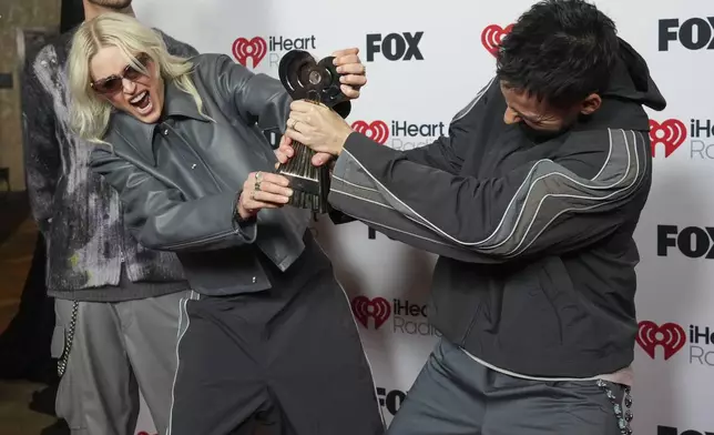 Emily Armstrong, left, and Mike Shinoda of Linkin Park arrive at the iHeartRadio Music Awards, Monday, March 17, 2025, at the Dolby Theatre in Los Angeles. (Photo by Jordan Strauss/Invision/AP)