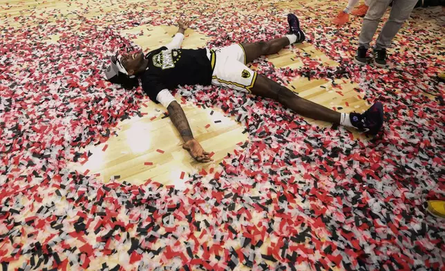 Virginia Commonwealth forward Christian Fermin celebrates after an NCAA college basketball game in the championship of the Atlantic 10 tournament, Sunday, March 16, 2025, in Washington. (AP Photo/Nick Wass)