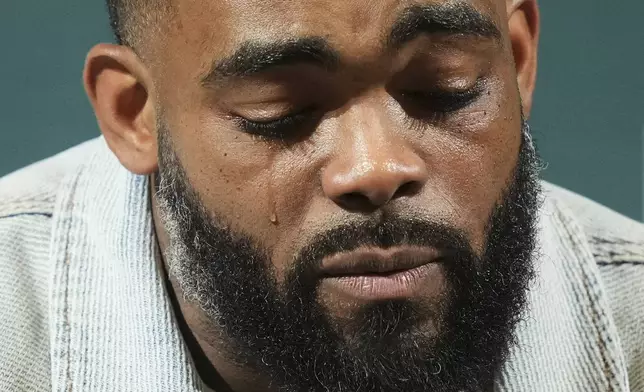 Brandon Graham cries during a news conference announcing his retirement, Tuesday, March 18, 2025, at the Philadelphia Eagles' NFL football training facility in Philadelphia. (AP Photo/Matt Rourke