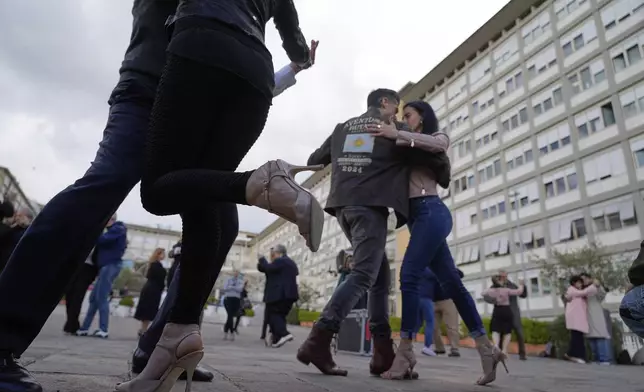 Tango dancers perform for Pope Francis outside the Agostino Gemelli Polyclinic in Rome, Sunday, March 16, 2025, where he is being treated for bilateral pneumonia since Feb. 14. (AP Photo/Gregorio Borgia)