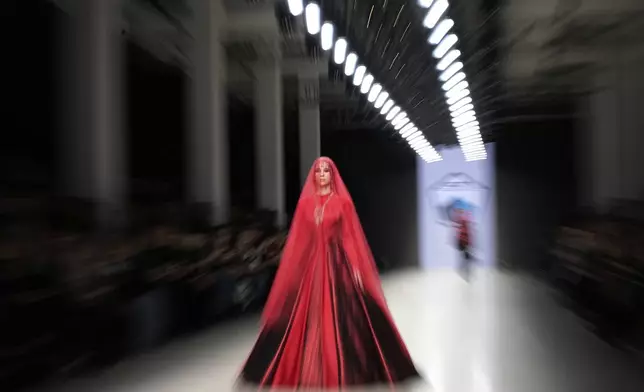 A model wears a creation by designers of the ASLP DAGESTAN from Dagestan republic of Russia during the Moscow Fashion Week, in Moscow, Russia, Saturday, March 15, 2025. (AP Photo/Alexander Zemlianichenko)