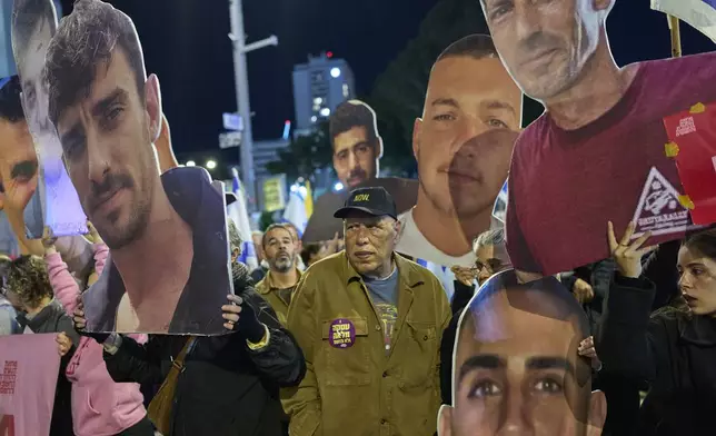 People take part in a protest demanding the immediate release of hostages held by Hamas in the Gaza Strip, in Tel Aviv, Israel, Saturday, March 22, 2025. (AP Photo/Ohad Zwigenberg)