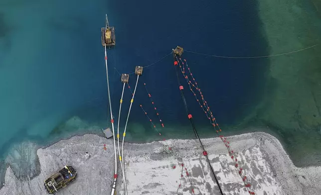 An aerial view of an open-pit sump at the Cobre Panama copper mine during a press tour of the mine, owned by Canada's First Quantum Minerals, which was closed after the country's Supreme Court ruled that the mining concession was unconstitutional, in Donoso, Panama, Friday, March 21, 2025. (AP Photo/Matias Delacroix)