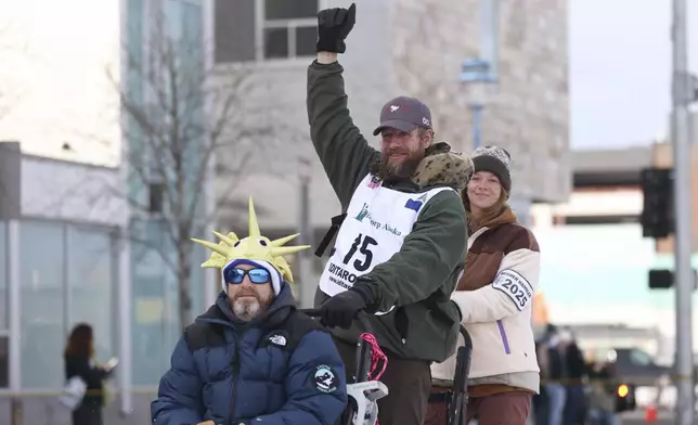 FILE - Jessie Holmes (15), of Alabama, mushes down Fourth Street during the Ceremonial Start of the Iditarod Trail Sled Dog Race in Anchorage, Alaska., Saturday, March 1, 2025. (AP Photo/Amanda Loman, File)