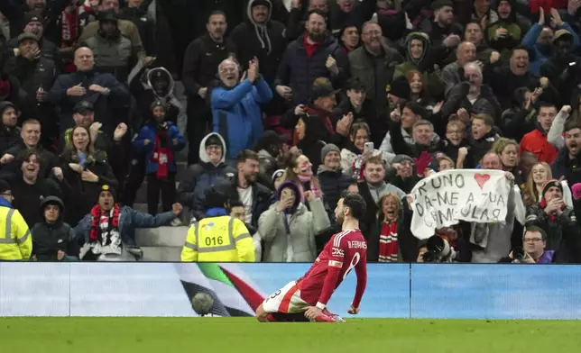 Manchester United's Bruno Fernandes celebrates after scoring his side's opening goal during the English FA Cup soccer match between Manchester United and Fulham at the Old Trafford stadium in Manchester, England, Sunday, March 2, 2025. (AP Photo/Jon Super)