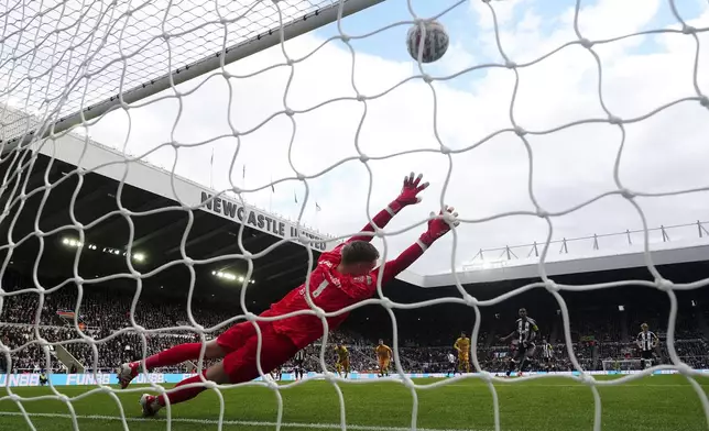 Newcastle United's Alexander Isak scores their side's first goal of the game from a penalty during the FA Cup fifth round match between Newcastle United and Brighton and Hove Albion at St James' Park, Newcastle, England, Sunday, March 2, 2025. (Owen Humphreys/PA via AP)