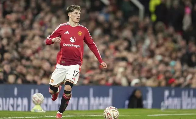 Manchester United's Alejandro Garnacho in action during the English FA Cup soccer match between Manchester United and Fulham at the Old Trafford stadium in Manchester, England, Sunday, March 2, 2025. (AP Photo/Jon Super)
