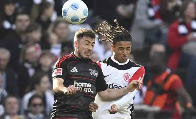 Frankfurt's Jean-Matt'o Bahoya, right and Union Berlin's Josip Juranovic vie for the ball, during the German Bundesliga soccer match between Eintracht Frankfurt and 1. FC Union Berlin at Deutsche Bank Park, in Frankfurt, Germany, Sunday, March 9, 2025. (Arne Dedert/dpa via AP)