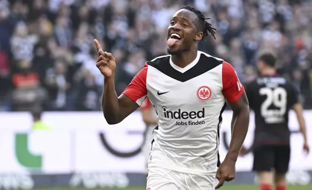 Frankfurt's Michy Batshuayi celebrates after his goal during the German Bundesliga soccer match between Eintracht Frankfurt and 1. FC Union Berlin at Deutsche Bank Park, in Frankfurt, Germany, Sunday, March 9, 2025. (Arne Dedert/dpa via AP)