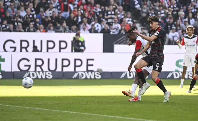Frankfurt's Michy Batshuayi shoots to score a goal, during the German Bundesliga soccer match between Eintracht Frankfurt and 1. FC Union Berlin at Deutsche Bank Park, in Frankfurt, Germany, Sunday, March 9, 2025. (Arne Dedert/dpa via AP)