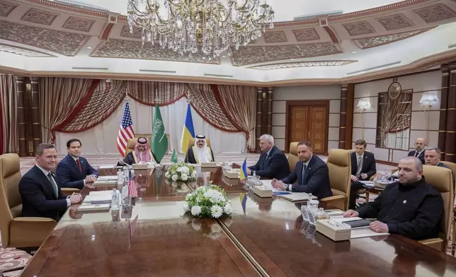 From left, US National Security Advisor Mike Waltz, US Secretary of State Marco Rubio, Saudi Foreign Minister Prince Faisal bin Farhan Al Saud, Saudi National Security Advisor Mosaad bin Mohammad al-Aiban, Ukrainian Foreign Minister Andrii Sybiha, Ukrainian Head of Presidential Office Andriy Yermak, and Ukrainian Minister of Defense Rustem Umerovto, hold a meeting in Jeddah, Saudi Arabia, Tuesday, March 11, 2025. (Saul Loeb/Pool Photo via AP)