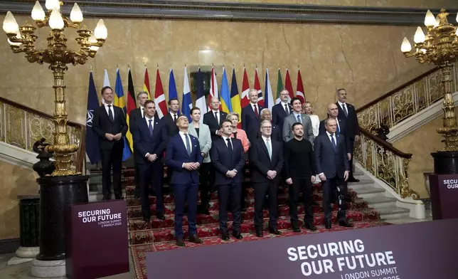 Britain's Prime Minister Keir Starmer, front center, and Ukraine's President Volodymyr Zelenskyy, front center right, pose with European leaders during a summit on Ukraine at Lancaster House in London, Sunday, March 2, 2025. (AP Photo/Christophe Ena, Pool)