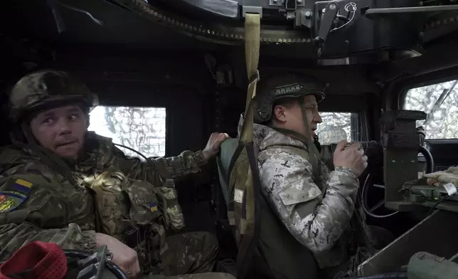 In this photo provided by Ukraine's 65th Mechanised Brigade press service, Ukrainian servicemen drive the US Humvee on the frontline in the Zaporizhzhia region, Ukraine, Thursday, March 6, 2025, (Andriy Andriyenko/Ukraine's 65th Mechanised Brigade via AP)