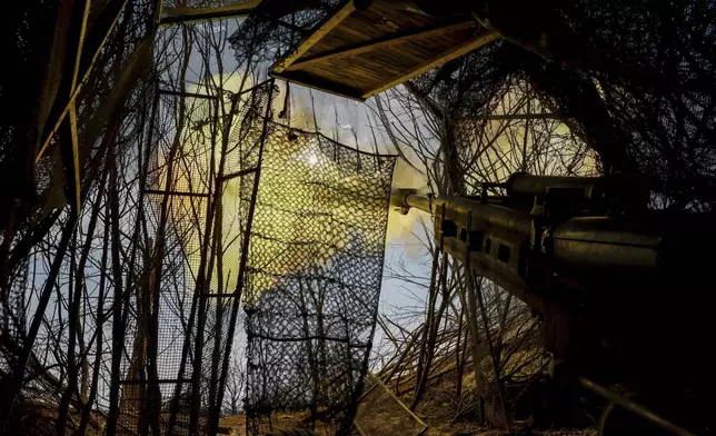 Ukrainian servicemen fire a M777 howitzer towards Russian positions at the front line near Donetsk, Ukraine, Monday, March 3, 2025. (AP Photo/Roman Chop)