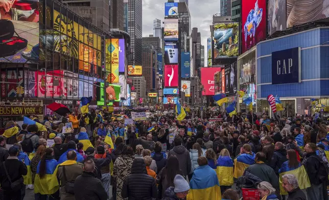 Members of the New York Ukrainian community and supporters gather in Times Square, Saturday, March 1, 2025 in New York. (AP Photo/Adam Gray)