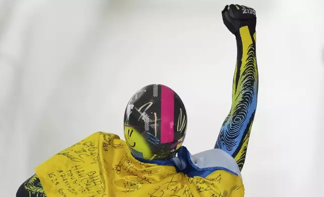 Vladyslav Heraskevych, of Ukraine, reacts after finishing his fourth run at the skeleton world championships, Friday, March 7, 2025, in Lake Placid, N.Y. (AP Photo/Julia Demaree Nikhinson)