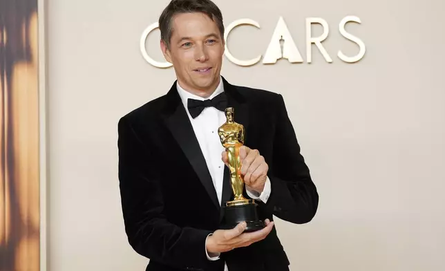 Sean Baker, winner of the award for best film editing for "Anora," poses in the press room at the Oscars on Sunday, March 2, 2025, at the Dolby Theatre in Los Angeles. (Photo by Jordan Strauss/Invision/AP)