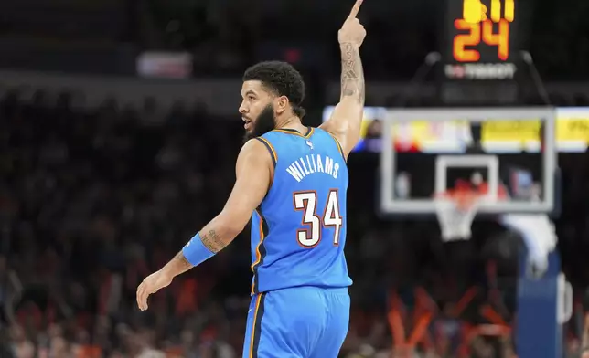 Oklahoma City Thunder forward Kenrich Williams celebrates during the second half of an NBA basketball game against the Philadelphia 76ers, Wednesday, March 19, 2025, in Oklahoma City. (AP Photo/Kyle Phillips)