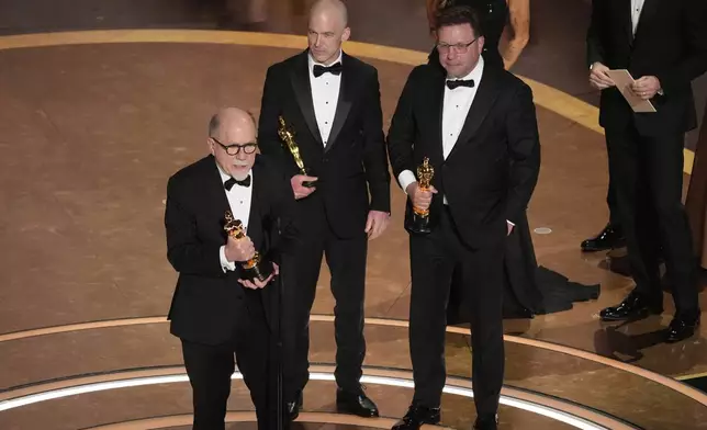 Richard King, from left, Gareth John, and Ron Bartlett accept the award for best sound for "Dune: Part Two" during the Oscars on Sunday, March 2, 2025, at the Dolby Theatre in Los Angeles. (AP Photo/Chris Pizzello)