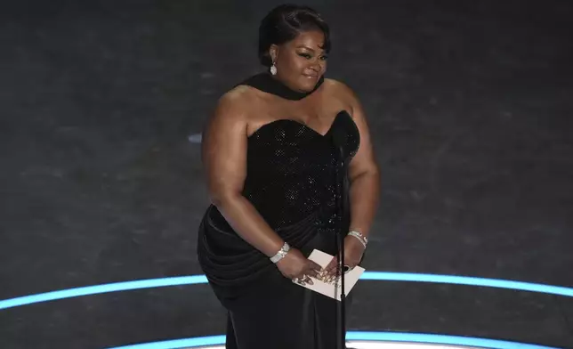 Da'Vine Joy Randolph presents the award for best performance by an actress in a supporting role during the Oscars on Sunday, March 2, 2025, at the Dolby Theatre in Los Angeles. (AP Photo/Chris Pizzello)