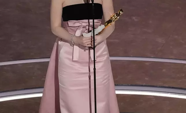 Mikey Madison accepts the award for best performance by an actress in a leading role for "Anora" during the Oscars on Sunday, March 2, 2025, at the Dolby Theatre in Los Angeles. (AP Photo/Chris Pizzello)