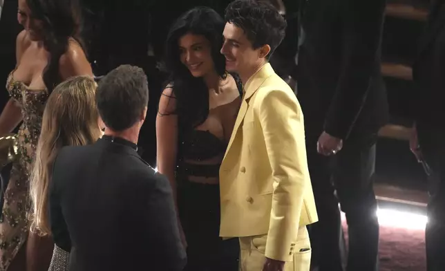 Shauna Robertson, from left, Edward Norton, Kylie Jenner and Timothée Chalamet appear in the audience during the Oscars on Sunday, March 2, 2025, at the Dolby Theatre in Los Angeles. (AP Photo/Chris Pizzello)
