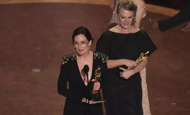 Molly O'Brien, left, and Lisa Remington accept the award for best documentary short film for "The Only Girl in the Orchestra" during the Oscars on Sunday, March 2, 2025, at the Dolby Theatre in Los Angeles. (AP Photo/Chris Pizzello)