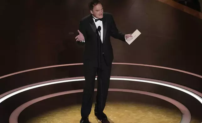 Quentin Tarantino presents the award for best director during the Oscars on Sunday, March 2, 2025, at the Dolby Theatre in Los Angeles. (AP Photo/Chris Pizzello)