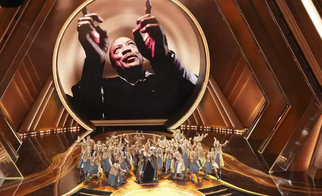 Queen Latifah, center, performs "Ease on Down the Road" during the Oscars on Sunday, March 2, 2025, at the Dolby Theatre in Los Angeles. (AP Photo/Chris Pizzello)