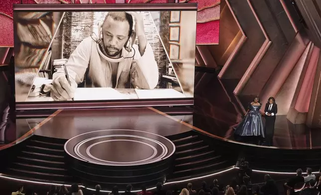 Whoopi Goldberg, left, and Oprah pay tribute to Quincy Jones during the Oscars on Sunday, March 2, 2025, at the Dolby Theatre in Los Angeles. (AP Photo/Chris Pizzello)