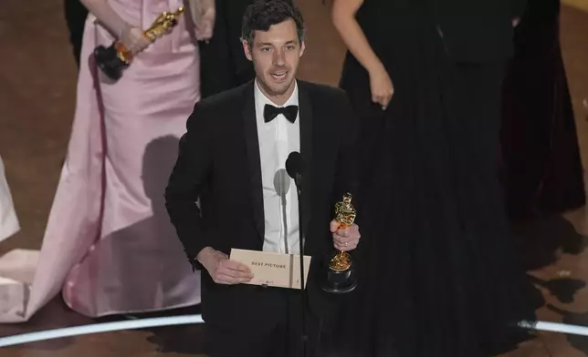 Alex Coco accepts the award for best picture for "Anora" during the Oscars on Sunday, March 2, 2025, at the Dolby Theatre in Los Angeles. (AP Photo/Chris Pizzello)