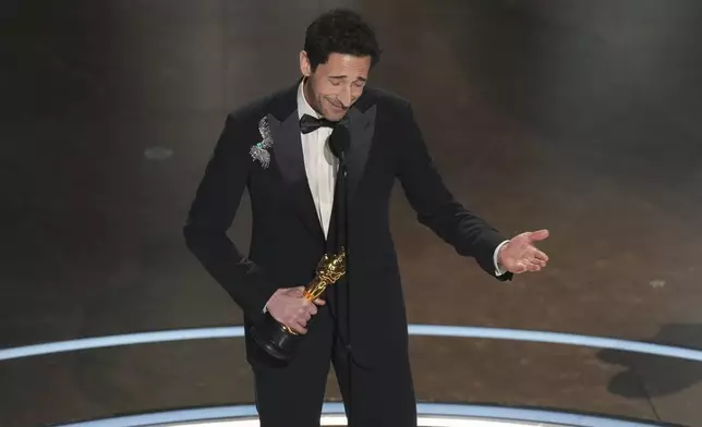 Adrien Brody accepts the award for best performance by an actor in a leading role for "The Brutalist" during the Oscars on Sunday, March 2, 2025, at the Dolby Theatre in Los Angeles. (AP Photo/Chris Pizzello)