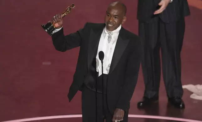 Paul Tazewell accepts the award for best costume design for "Wicked" during the Oscars on Sunday, March 2, 2025, at the Dolby Theatre in Los Angeles. (AP Photo/Chris Pizzello)