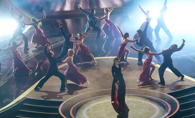 Lisa, center, sings "Live and Let Die" during the Oscars on Sunday, March 2, 2025, at the Dolby Theatre in Los Angeles. (AP Photo/Chris Pizzello)