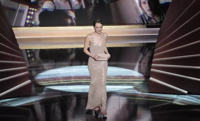 Emma Stone presents the award for best performance by an actress in a leading role during the Oscars on Sunday, March 2, 2025, at the Dolby Theatre in Los Angeles. (AP Photo/Chris Pizzello)