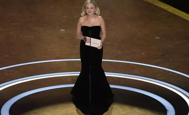 Amy Poehler presents the award for best original screenplay during the Oscars on Sunday, March 2, 2025, at the Dolby Theatre in Los Angeles. (AP Photo/Chris Pizzello)