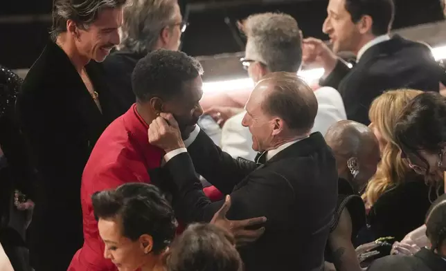 Colman Domingo, left, and Ralph Fiennes in the audience during the Oscars on Sunday, March 2, 2025, at the Dolby Theatre in Los Angeles. (AP Photo/Chris Pizzello)