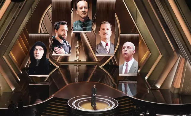 Robert Downey Jr. presents the award for best performance by an actor in a supporting role during the Oscars on Sunday, March 2, 2025, at the Dolby Theatre in Los Angeles. (AP Photo/Chris Pizzello)