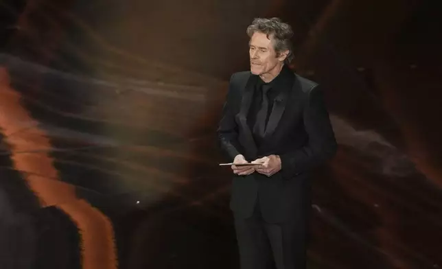 Willem Dafoe presents the award for best cinematography during the Oscars on Sunday, March 2, 2025, at the Dolby Theatre in Los Angeles. (AP Photo/Chris Pizzello)