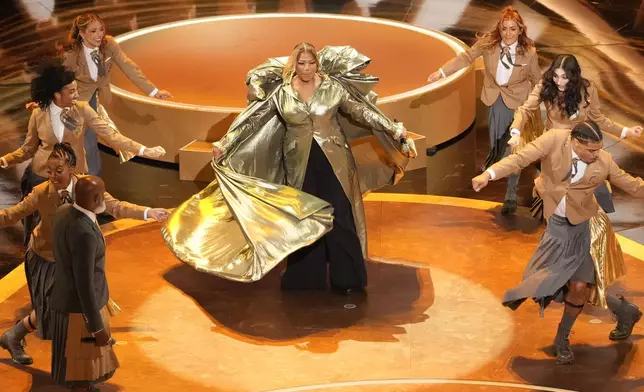 Queen Latifah, center, performs "Ease on Down the Road" during the Oscars on Sunday, March 2, 2025, at the Dolby Theatre in Los Angeles. (AP Photo/Chris Pizzello)